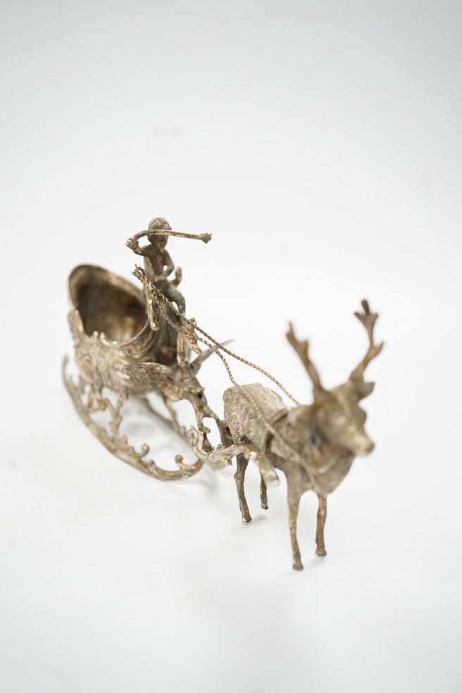 A modern continental silver sleigh with putto and reindeer, import marks for London, 1974, 16cm. Condition - poor